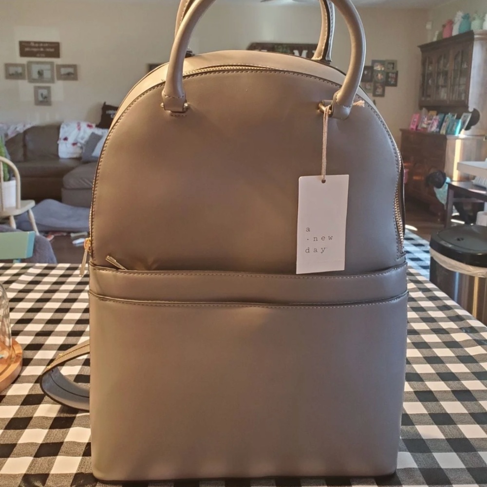 A new day backpack purse